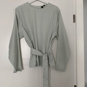 Green and white check blouse